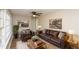 Inviting living room with hardwood floors, neutral paint, a ceiling fan, natural light and leather furniture at 272 Old Sudie Rd, Hiram, GA 30141