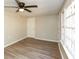 A well-lit living room featuring vinyl floors, white trim and neutral walls at 272 Old Sudie Rd, Hiram, GA 30141