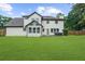 Spacious backyard with lush lawn and cozy outdoor seating area perfect for relaxation at 4605 Tims Pl, Snellville, GA 30039