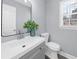 Bathroom features white cabinets and sink, gray paint, and natural light at 4605 Tims Pl, Snellville, GA 30039
