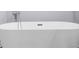 A close-up of a white bathtub with modern chrome fixtures at 4605 Tims Pl, Snellville, GA 30039