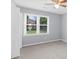 A carpeted bedroom with a window at 4605 Tims Pl, Snellville, GA 30039
