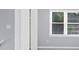 This bedroom features light gray walls and a window with blinds at 4605 Tims Pl, Snellville, GA 30039