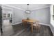 The dining area is bright with natural light and features hardwood floors at 4605 Tims Pl, Snellville, GA 30039