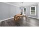 This dining room features an overhead light fixture and lots of natural light at 4605 Tims Pl, Snellville, GA 30039