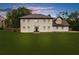 Charming two-story home with a lush green lawn and beautiful landscaping at 4605 Tims Pl, Snellville, GA 30039