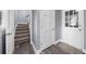 Hallway featuring a stairwell, entry door, and access to other rooms at 4605 Tims Pl, Snellville, GA 30039