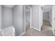 Hallway featuring neutral carpet and light gray walls at 4605 Tims Pl, Snellville, GA 30039