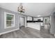 Spacious kitchen with grey-toned walls and flooring, featuring ample cabinet space and an island at 4605 Tims Pl, Snellville, GA 30039