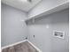 This is a laundry room featuring white shelves and utility connections at 4605 Tims Pl, Snellville, GA 30039