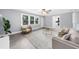 This living room has lots of natural light, neutral paint, a fireplace, and hardwood floors at 4605 Tims Pl, Snellville, GA 30039