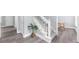 Hallway with stairwell featuring natural light and hardwood floors at 4605 Tims Pl, Snellville, GA 30039