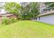 A view of the wide-open backyard with a long chain-link fence at 6715 Kimberly Mill Rd, Atlanta, GA 30349