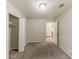 Bedroom featuring a window, carpet flooring, a closet, and neutral walls at 6715 Kimberly Mill Rd, Atlanta, GA 30349