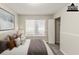 This bedroom features a large window, closet, and a neutral color palette at 6715 Kimberly Mill Rd, Atlanta, GA 30349
