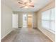 The bedroom boasts ample space, a ceiling fan, and easy access to the bathroom and closet at 6715 Kimberly Mill Rd, Atlanta, GA 30349