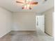 This carpeted bedroom features a ceiling fan and neutral paint at 6715 Kimberly Mill Rd, Atlanta, GA 30349