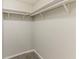 An empty walk-in closet features white walls and shelves at 6715 Kimberly Mill Rd, Atlanta, GA 30349