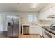 Well-lit kitchen featuring stainless steel appliances and hardwood floors at 6715 Kimberly Mill Rd, Atlanta, GA 30349