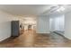 Open-concept floor plan connecting the kitchen and living room area with hardwood floors at 6715 Kimberly Mill Rd, Atlanta, GA 30349
