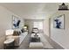 Bright living room is virtually staged and features modern decor and neutral colors at 6715 Kimberly Mill Rd, Atlanta, GA 30349