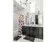Bright bathroom featuring a double vanity, modern lighting and colorful shower curtain at 135 Mado Ln, Chattahoochee Hills, GA 30268