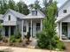 Charming home exterior with well-manicured landscaping and inviting front porch at 135 Mado Ln, Chattahoochee Hills, GA 30268