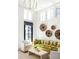 Bright living room featuring high ceilings, wood floors, stylish decor, and large windows at 135 Mado Ln, Chattahoochee Hills, GA 30268