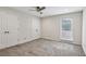 Bedroom with carpet, double closets, ceiling fan and natural light at 1719 Woodcliff Ne Ct, Atlanta, GA 30329