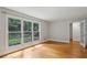 Bonus room with hardwood floors, neutral paint, large window, and glass paneled door at 1719 Woodcliff Ne Ct, Atlanta, GA 30329