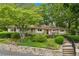 Charming home with manicured landscaping and stone retaining wall at 1719 Woodcliff Ne Ct, Atlanta, GA 30329