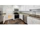 Modern kitchen with stainless steel appliances, white cabinetry, and granite countertops at 1719 Woodcliff Ne Ct, Atlanta, GA 30329