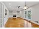 Bright living room with fireplace, hardwood floors, and french doors to the outside at 1719 Woodcliff Ne Ct, Atlanta, GA 30329