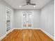 Bright, spacious room with hardwood floors, french doors, and a ceiling fan at 1719 Woodcliff Ne Ct, Atlanta, GA 30329