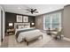 Comfortable primary bedroom with a large window, a ceiling fan, and neutral decor at 1719 Woodcliff Ne Ct, Atlanta, GA 30329