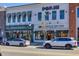 Charming storefronts featuring unique businesses like 'Avenue of the Oaks' and 'Pieces & Peaches' in downtown area at 2255 Windsor Bluffs Dr, Cumming, GA 30041