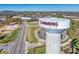 Aerial view of a Cumming, GA water tower with surrounding landscape and distant views of the town at 2255 Windsor Bluffs Dr, Cumming, GA 30041