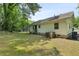 Home exterior with a grassy backyard and mature trees at 354 Henry Aaron Sw Ave, Atlanta, GA 30310