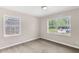 Bright bedroom with two windows, natural light and neutral color palette at 354 Henry Aaron Sw Ave, Atlanta, GA 30310