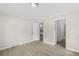 Neutral bedroom featuring modern flooring, trim and natural light from doorway at 354 Henry Aaron Sw Ave, Atlanta, GA 30310
