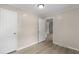 Neat bedroom with natural lighting, doorway, and modern flooring at 354 Henry Aaron Sw Ave, Atlanta, GA 30310
