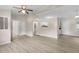 Spacious open-concept living area with updated flooring, modern ceiling fan, and neutral paint at 354 Henry Aaron Sw Ave, Atlanta, GA 30310