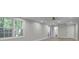 Finished basement boasts natural light, neutral tones, and modern vinyl flooring at 5400 Mill Run Dr, Marietta, GA 30068