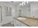 Light-filled bathroom with vanity, glass enclosed shower, and neutral color scheme at 5400 Mill Run Dr, Marietta, GA 30068
