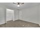 Bright bedroom with ceiling fan, door and closet; vinyl wood flooring throughout at 5400 Mill Run Dr, Marietta, GA 30068