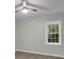 An airy bedroom with wood floors is enhanced by natural light from the window at 5400 Mill Run Dr, Marietta, GA 30068
