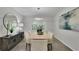 Well-lit dining room features a modern chandelier, artwork, and flows to the living room at 5400 Mill Run Dr, Marietta, GA 30068