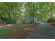 Well-maintained home with mature trees and a long driveway at 5400 Mill Run Dr, Marietta, GA 30068