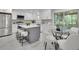 Stylish kitchen features white cabinets, stainless steel appliances, and an island with seating, plus dining area at 5400 Mill Run Dr, Marietta, GA 30068
