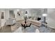 Bright living room featuring a comfortable sofa, an accent chair, and large windows with natural light at 5400 Mill Run Dr, Marietta, GA 30068